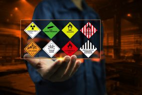 Industrial,Factory,Safety,Officers,Hold,Chemical,Hazard,Warning,Signs,In