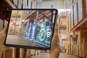 Futuristic,Technology,Warehouse:,Worker,Doing,Inventory,And,Using,Augmented,Reality